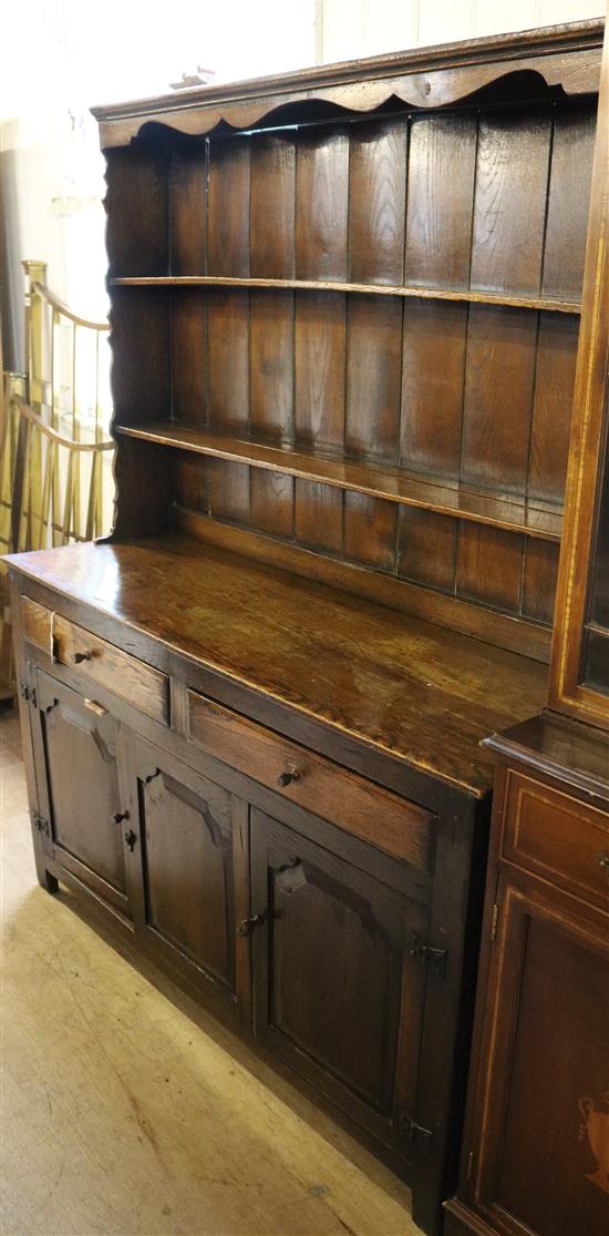 Oak dresser, fitted open shelves, two short drawers and a pair of panelled doors(-)